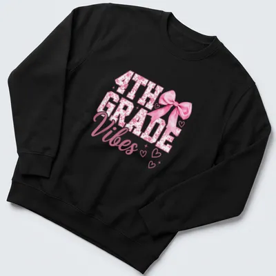 Illustration of a pink bow with hearts alongside the text 4TH GRADE Vibes — printed on a unisex sweatshirt