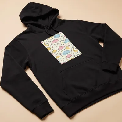 Kawaii doodle of clouds, stars, moons, and wands in pastel colors — printed on a unisex hoodie