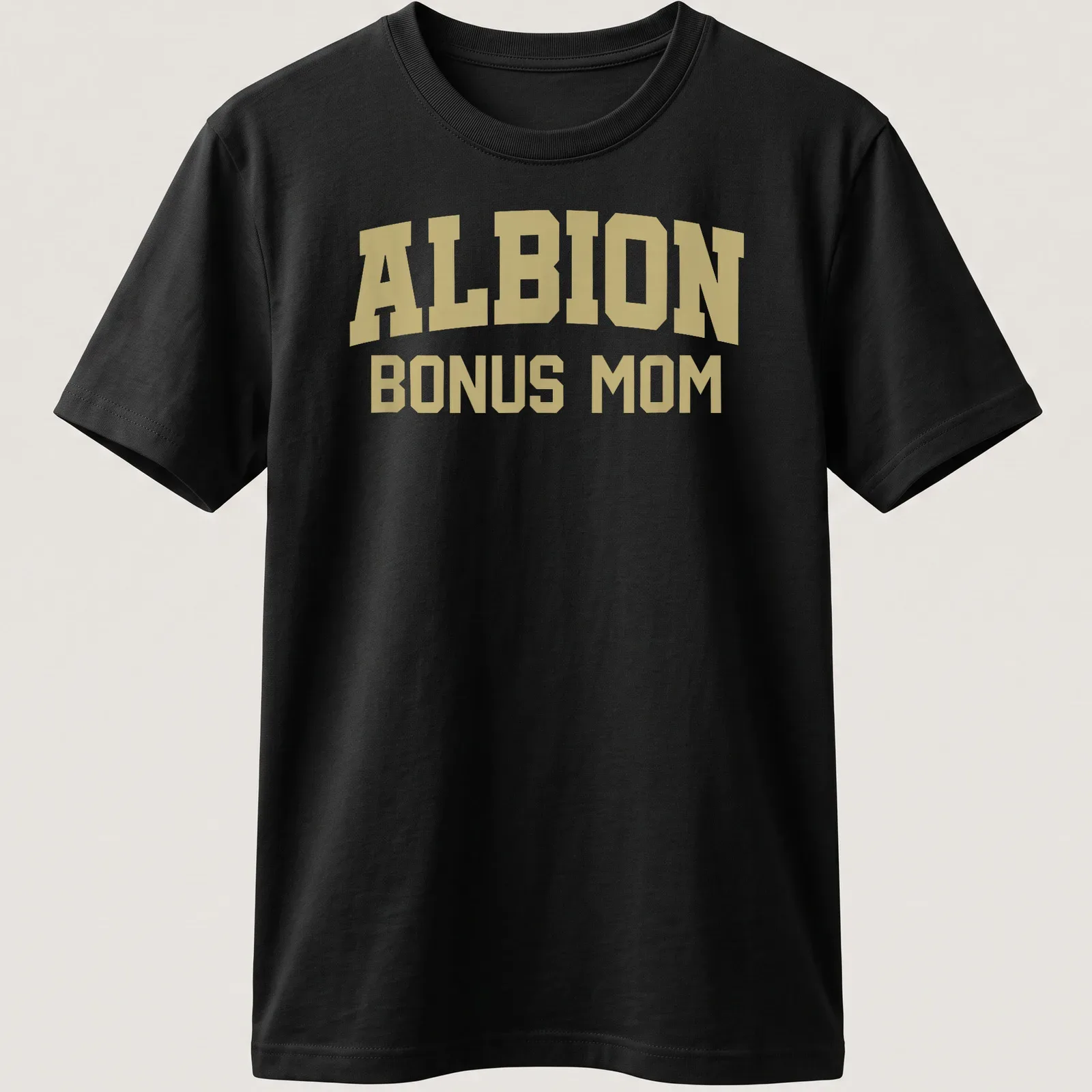 Bold collegiate print of ALBION BONUS MOM in gold — printed on a unisex t-shirt