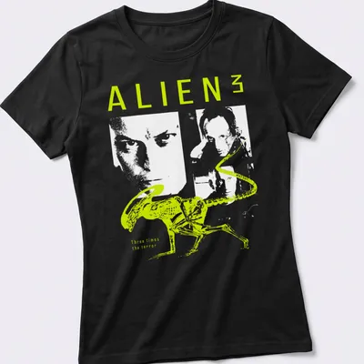 Minimalist graphic of an alien with neon green and white typography — printed on a women's shirt