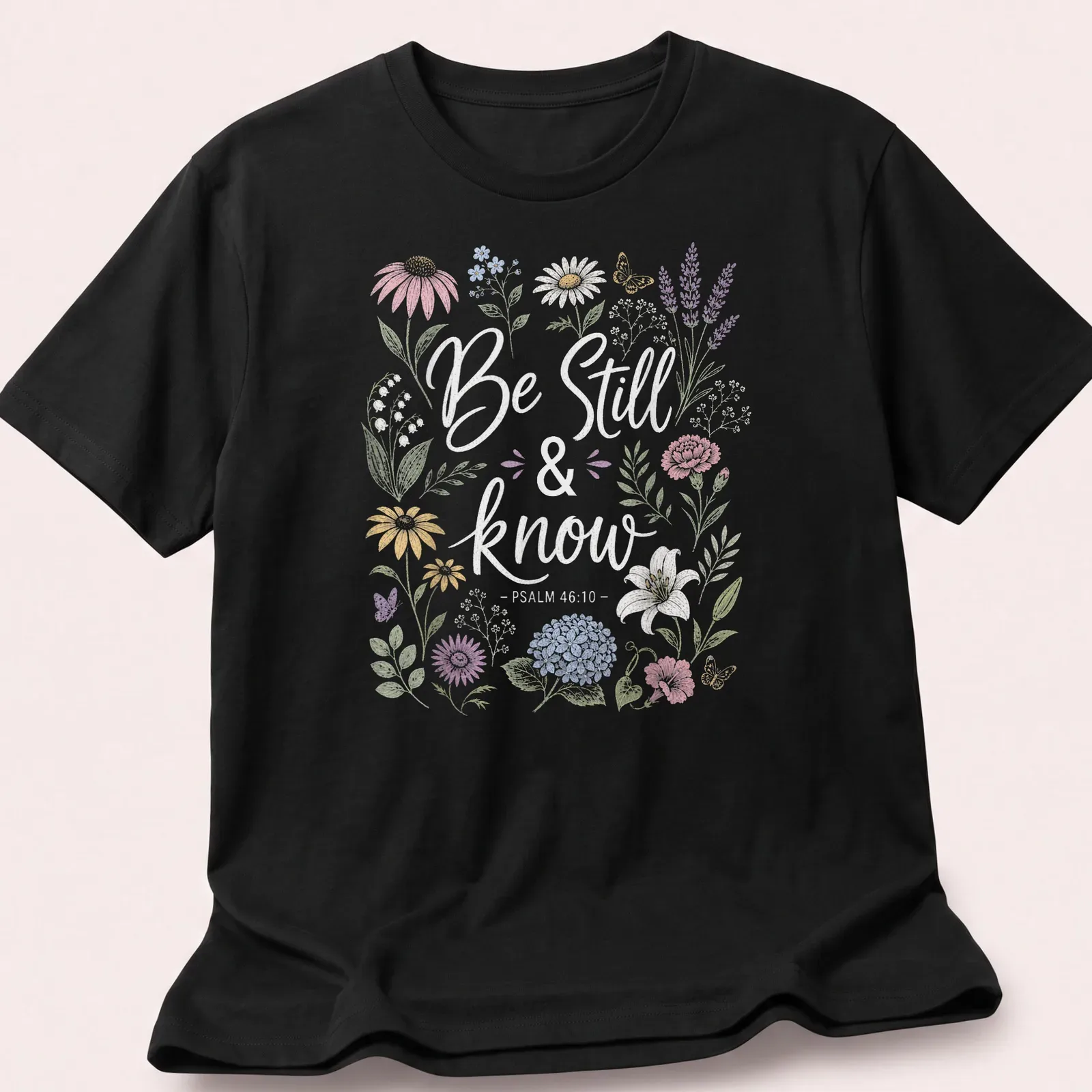 Floral design with the text Be Still & know - PSALM 46:10 in vintage style — printed on a unisex t-shirt