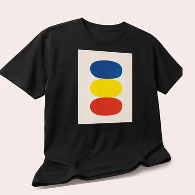 Minimalist color block design in blue, yellow, and red — printed on a unisex t-shirt (angled view)