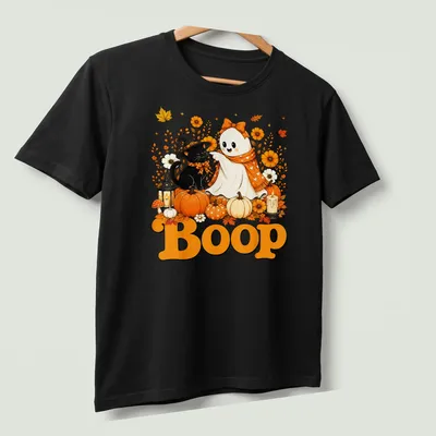 Kawaii illustration of a cute ghost and black cat with 'Boop' text in a Halloween theme — printed on a unisex t-shirt (angled view)