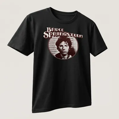 Vintage Bruce Springsteen t-shirt with distressed text in brown, black, and white. — printed on a unisex t-shirt (angled view)