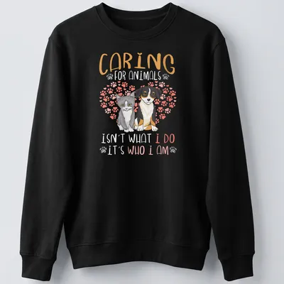 Illustrative design featuring a gray cat and dog with a heartfelt message on caring for animals — printed on a unisex sweatshirt
