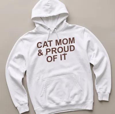 Bold typography of 'Cat Mom & Proud Of It' on a brown — printed on a unisex hoodie
