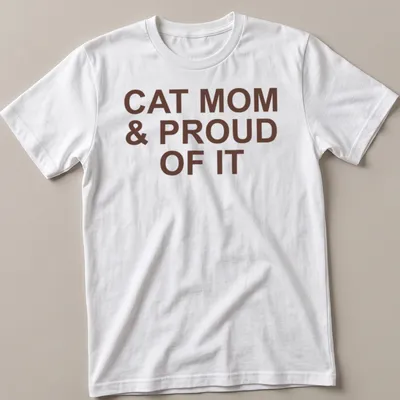 Bold typography of 'Cat Mom & Proud Of It' on a brown shirt