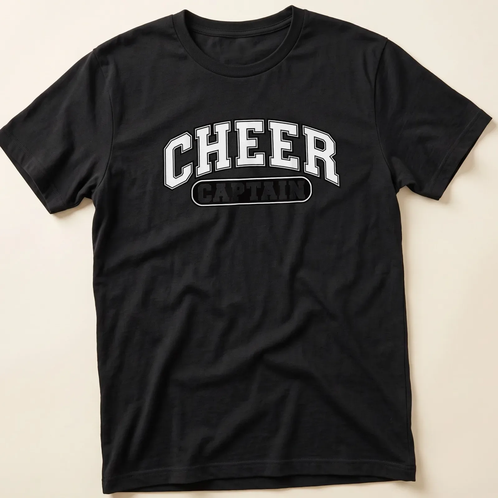 Bold collegiate Cheer Captain t-shirt in black and white typography — printed on a unisex t-shirt