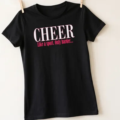 Playful typography Cheer Like a Sport Only Harder t-shirt in pink and white — printed on a women's shirt