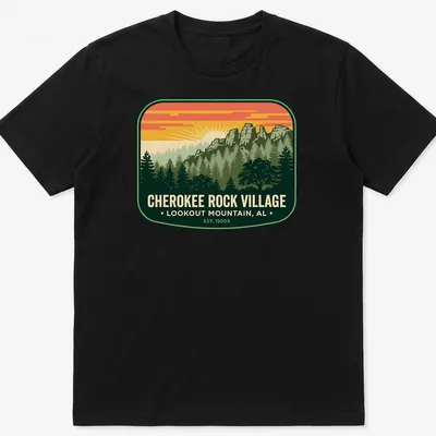 Vintage badge tee with mountain landscape and trees in green, orange, yellow, and blue