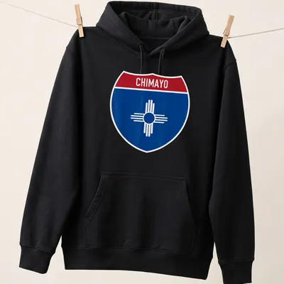 Chimayo New Mexico shirt featuring a shield design with bold lettering — printed on a unisex hoodie