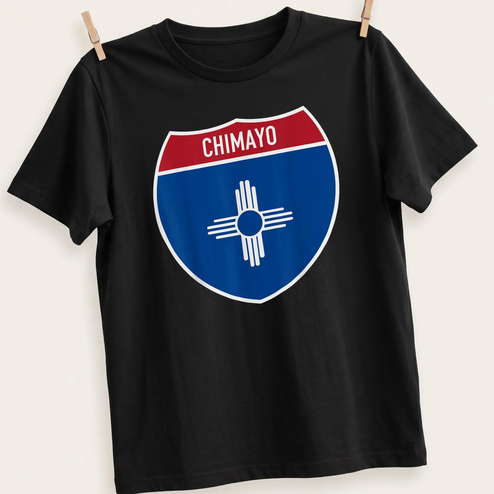 Chimayo New Mexico shirt featuring a shield design with bold lettering — printed on a unisex t-shirt