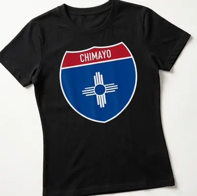 Chimayo New Mexico shirt featuring a shield design with bold lettering — printed on a women's shirt