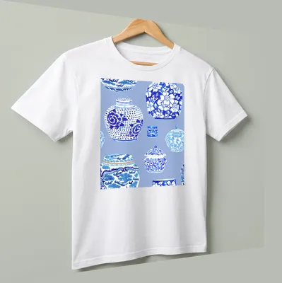 Watercolor illustration of ginger jars in blue and white tones — printed on a unisex t-shirt (angled view)