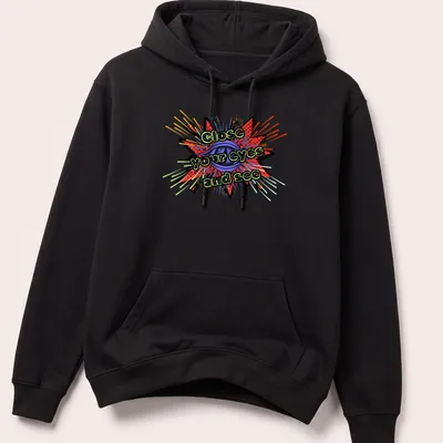 Inspirational T-shirt with bold text and an eye graphic bursting with colorful rays — printed on a unisex hoodie