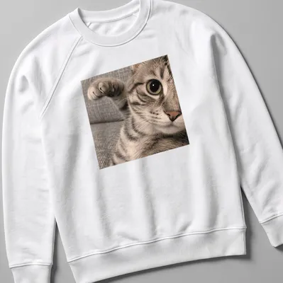 Photographic print of a curious tabby cat with intricate fur patterns — printed on a unisex sweatshirt