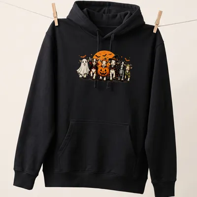 Cartoon-style t-shirt featuring goats in Halloween costumes, including a ghost — printed on a unisex hoodie