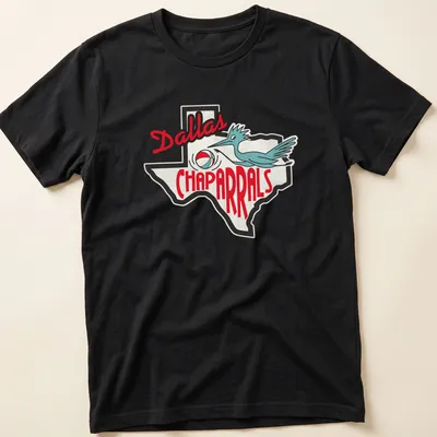Retro Dallas Chaparrals T-shirt with a bluebird dribbling a basketball above the team name in red and blue.