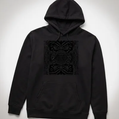 Black and white line art t-shirt featuring abstract tribal faces — printed on a unisex hoodie