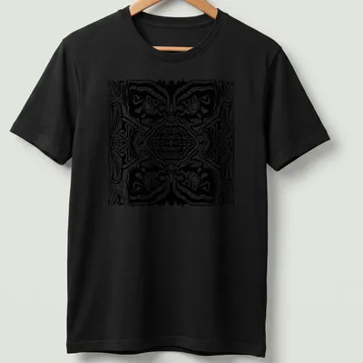 Black and white line art t-shirt featuring abstract tribal faces