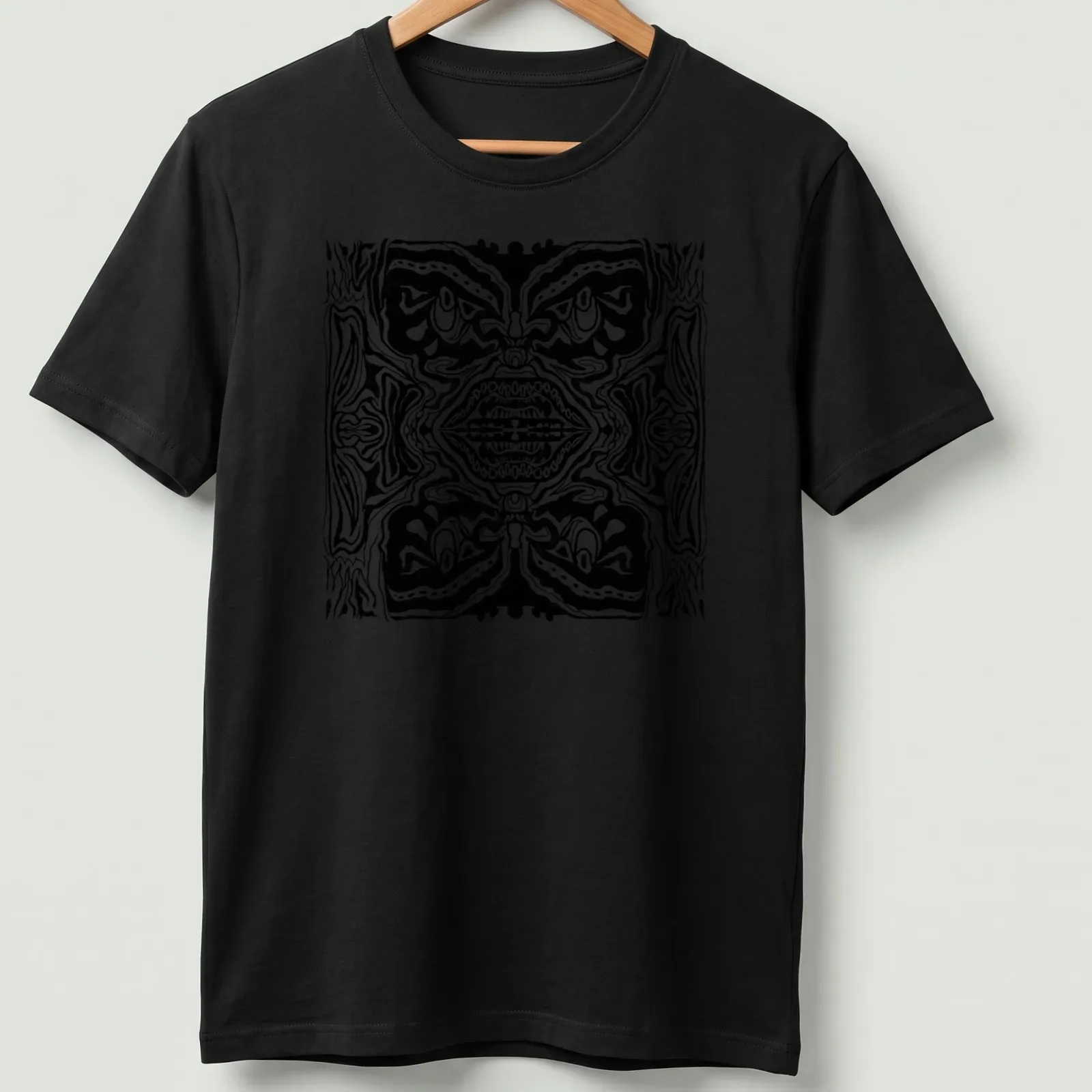 Black and white line art t-shirt featuring abstract tribal faces — printed on a unisex t-shirt