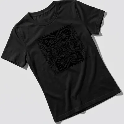 Black and white line art t-shirt featuring abstract tribal faces — printed on a women's shirt