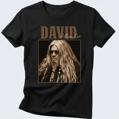 Vintage David Allan Coe t-shirt with distressed typography in brown and beige — printed on a women's shirt