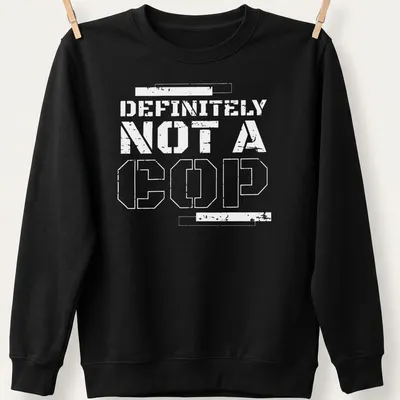 Bold statement t-shirt with the text 'DEFINITELY NOT A COP' in black and white — printed on a unisex sweatshirt