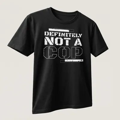 Bold statement t-shirt with the text 'DEFINITELY NOT A COP' in black and white — printed on a unisex t-shirt (angled view)