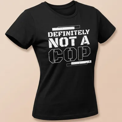 Bold statement t-shirt with the text 'DEFINITELY NOT A COP' in black and white — printed on a women's shirt