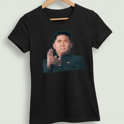 Photomontage of a dictator's portrait in skin tones, black, and red. — printed on a women's shirt