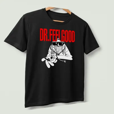 Cartoon-style Dr. Feelgood T-shirt with mad doctor illustration in red and black — printed on a unisex t-shirt (angled view)