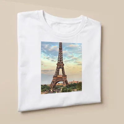 Photographic print of the Eiffel Tower in a colorful Paris landscape — printed on a unisex t-shirt (angled view)