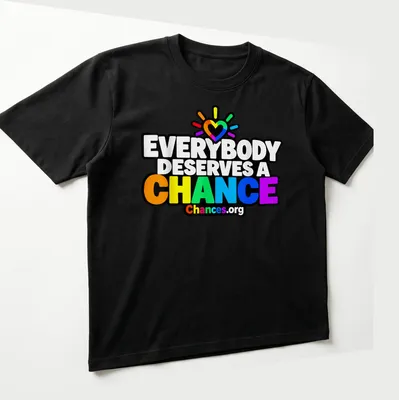 Colorful rainbow heart design with text promoting second chances — printed on a unisex t-shirt (angled view)