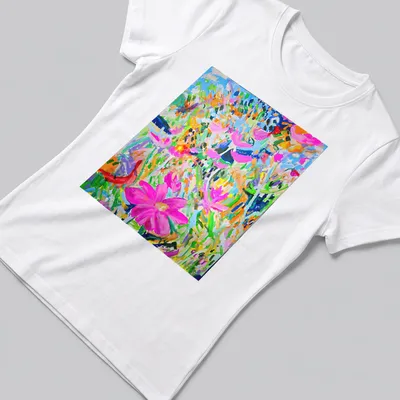 Abstract illustration of colorful flowers in pink, blue, green, orange, and purple — printed on a women's shirt