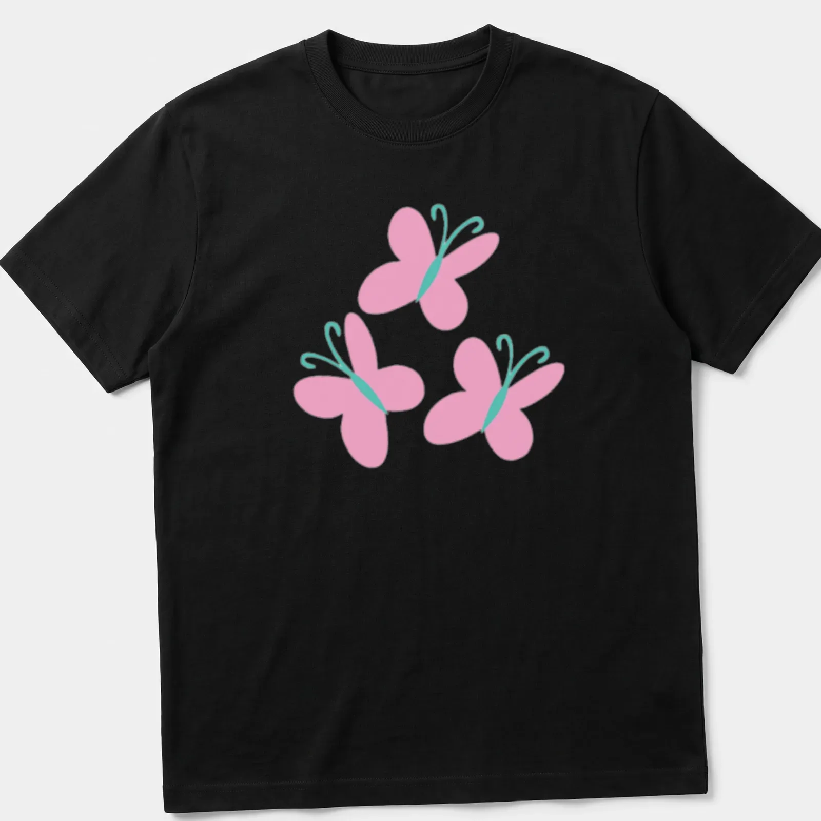 Kawaii pink butterflies design on a light pink t-shirt with aqua accents. — printed on a unisex t-shirt