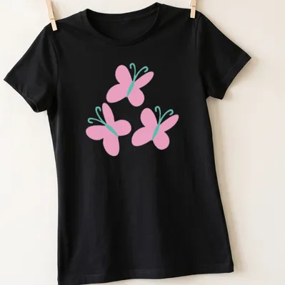 Kawaii pink butterflies design on a light pink t-shirt with aqua accents. — printed on a women's shirt