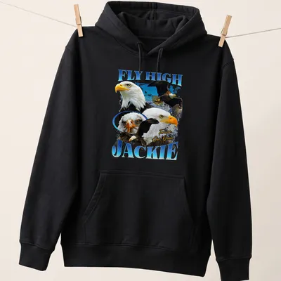 Bald Eagle in flight with text 'FLY HIGH JACKIE Forever Our Queen' beneath — printed on a unisex hoodie