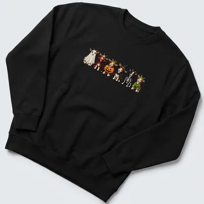 Cartoon goats in Halloween costumes including a witch and pumpkin — printed on a unisex sweatshirt