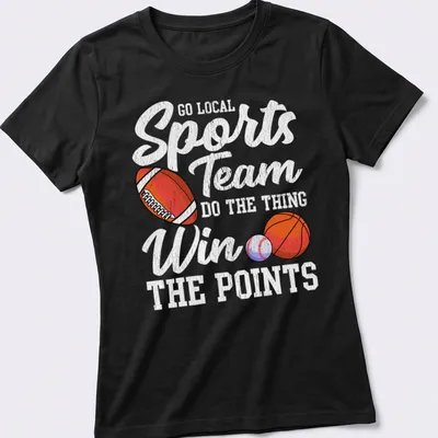 Retro distressed sports team graphic featuring a football, basketball, and baseball. — printed on a women's shirt