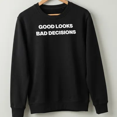 Funny t-shirt with bold lettering saying Good Looks, Bad Decisions — printed on a unisex sweatshirt