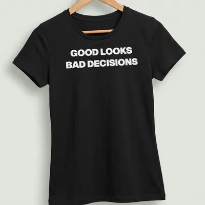 Funny t-shirt with bold lettering saying Good Looks, Bad Decisions — printed on a women's shirt