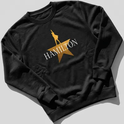 Gold star silhouette of a performer with the word Hamilton above in bold lettering — printed on a unisex sweatshirt
