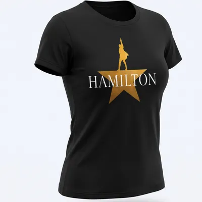 Gold star silhouette of a performer with the word Hamilton above in bold lettering — printed on a women's shirt