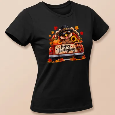 Colorful cartoon turkey in a vintage truck with Happy Thanksgiving text above. — printed on a women's shirt