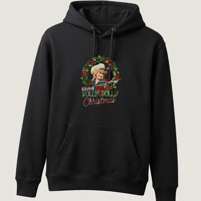 Festive illustration of Dolly Parton with the text Have a HOLLY DOLLY Christmas in green, red, white, and gold — printed on a unisex hoodie