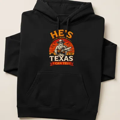 Vintage horror shirt with chainsaw ghost and Texan phrase in bold text — printed on a unisex hoodie