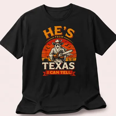 Vintage horror shirt with chainsaw ghost and Texan phrase in bold text