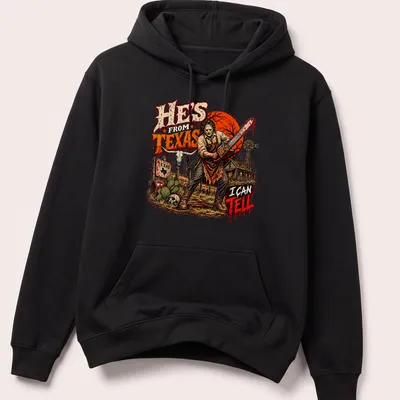 Horror illustration featuring a chainsaw-wielding character with dark lettering — printed on a unisex hoodie