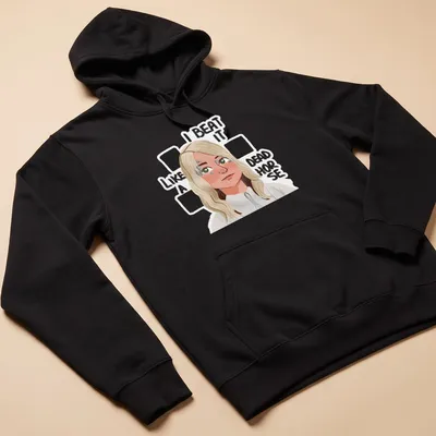 Cartoon figure with blonde hair and humorous text about beating a dead horse — printed on a unisex hoodie